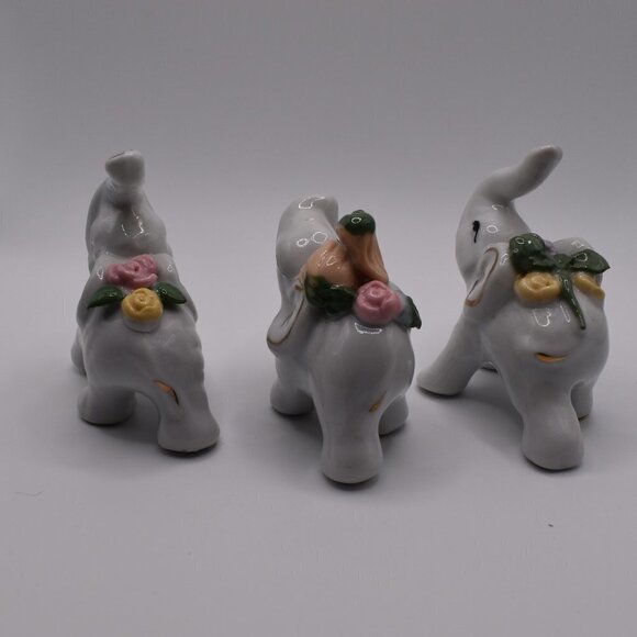 3 White Ceramic Elephants Carrying Flowers - Picture 3 of 8